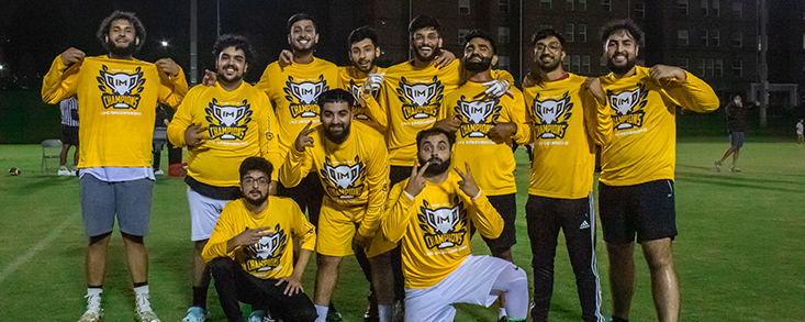Intramural team posing with champion t-shirts