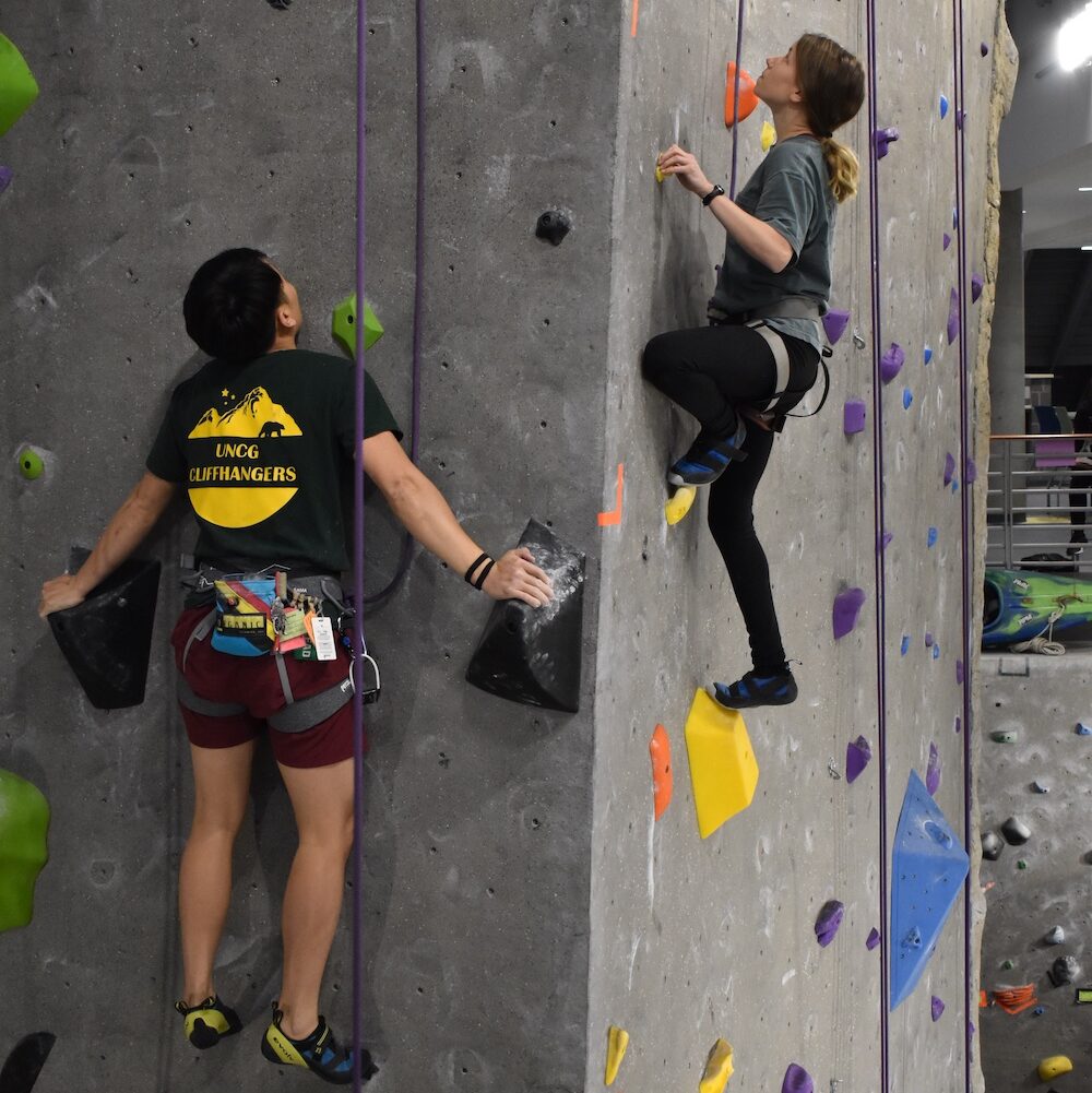 Students participating in Climbing Wall competition at the Kaplan Center class=img-responsive