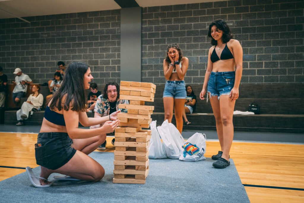 Students playing giant Jenga in the Kaplan Center