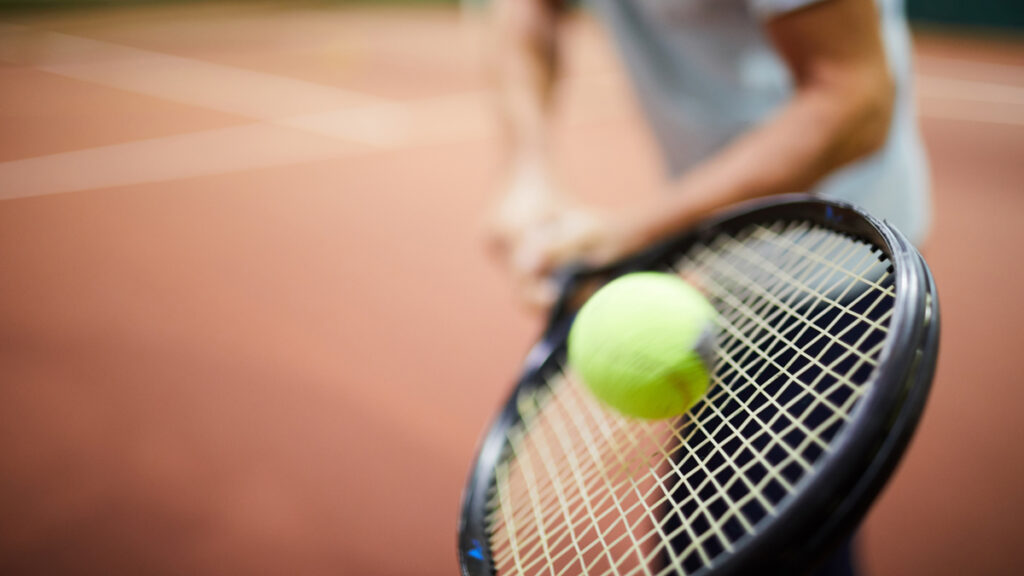 tennis ball hitting racquet