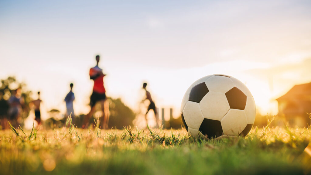 soccer ball with setting sun